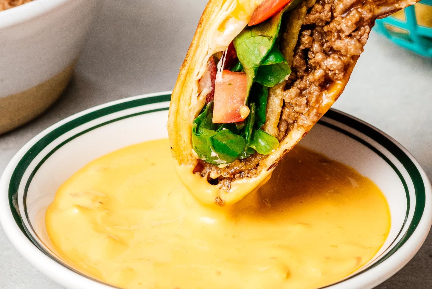 crunchwrap dipped in queso | sharefavoritefood.com