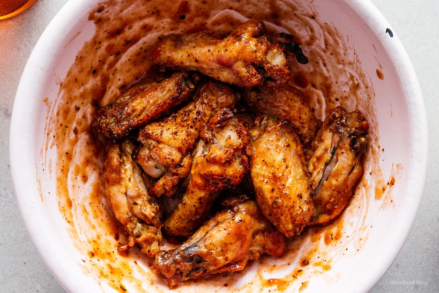air fryer chicken wings tossed in hot sauce | sharefavoritefood.com